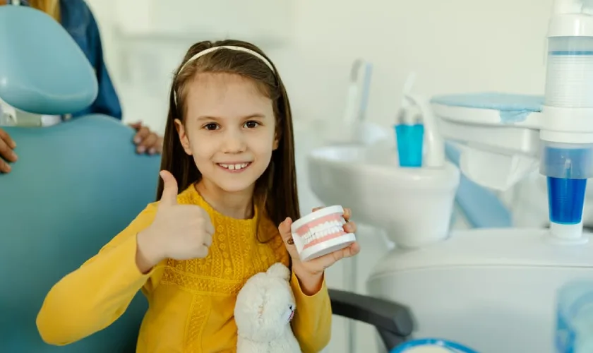 child with a dental space maintainer at Hometown Family Dental in Springdale AR child with a dental space maintainer at Hometown Family Dental in Springdale AR